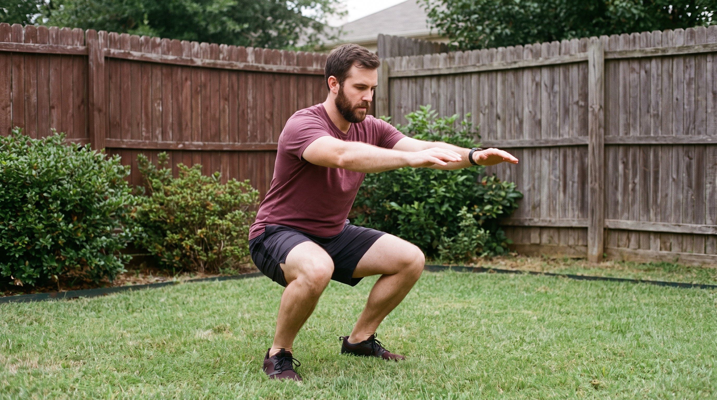Person doing bodyweight squats in a living room