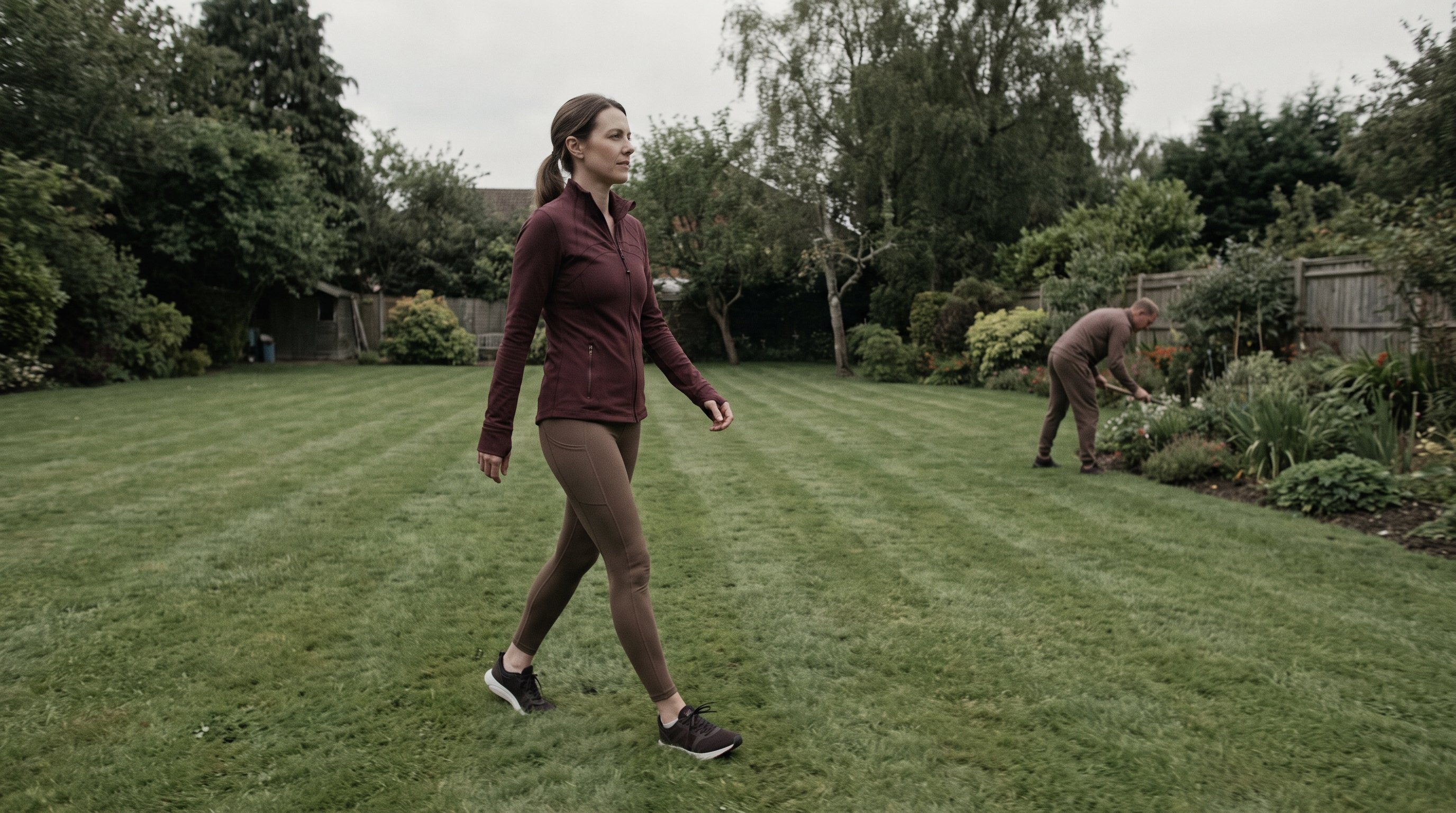 woman walking briskly through a city park during lunch break