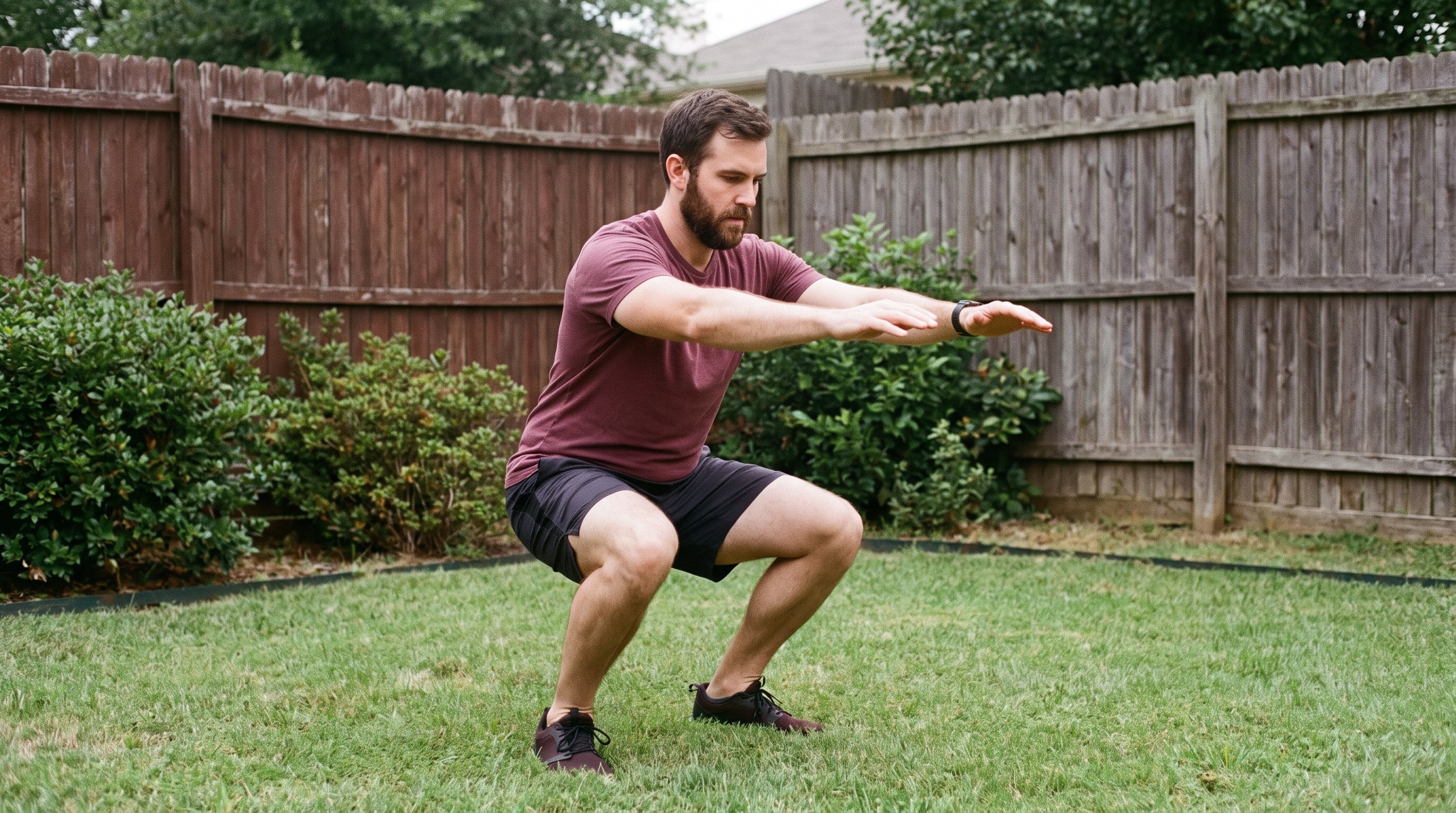 Person doing bodyweight squats in a living room