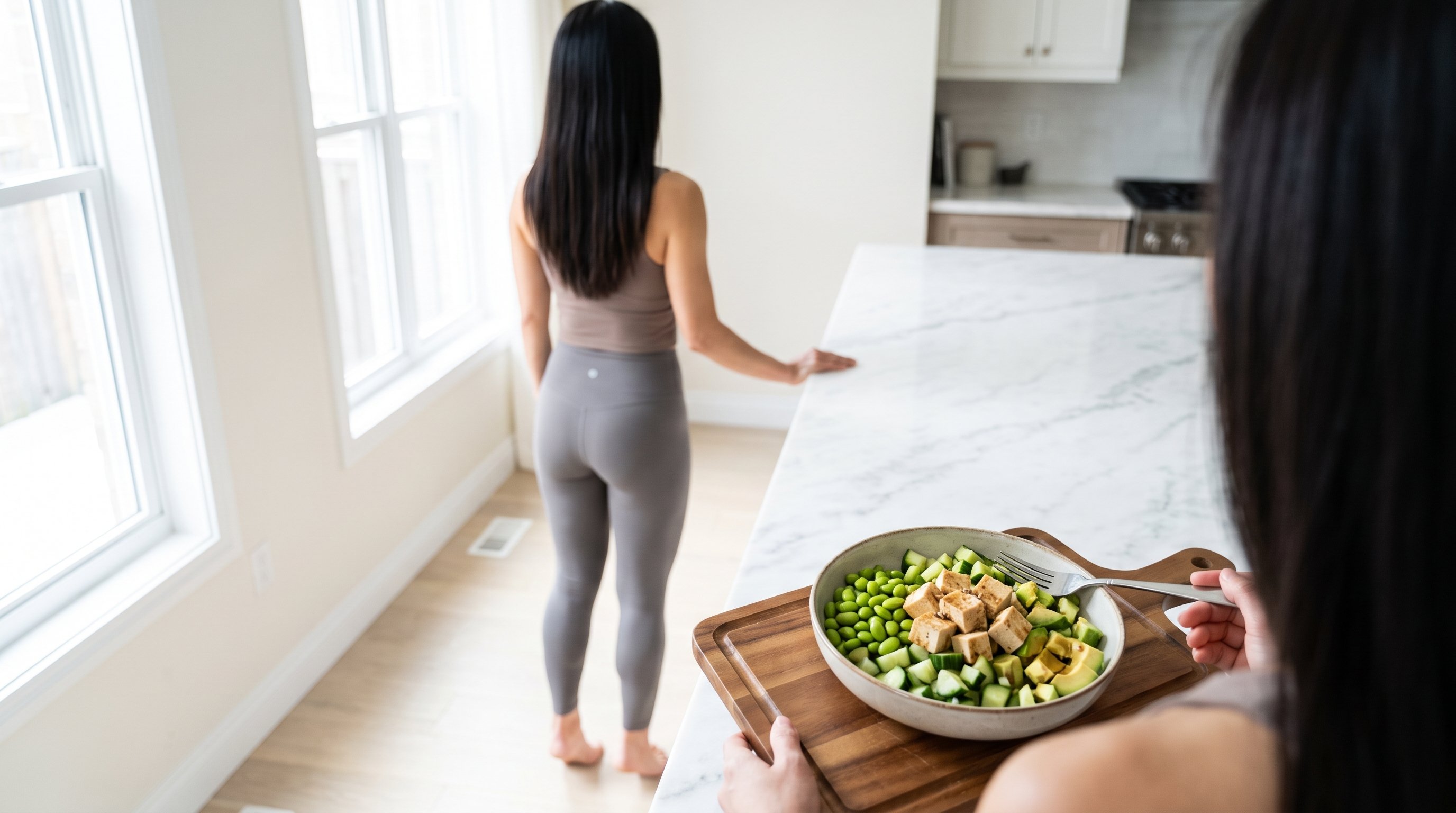 older adult doing supported chair squats near a kitchen counter