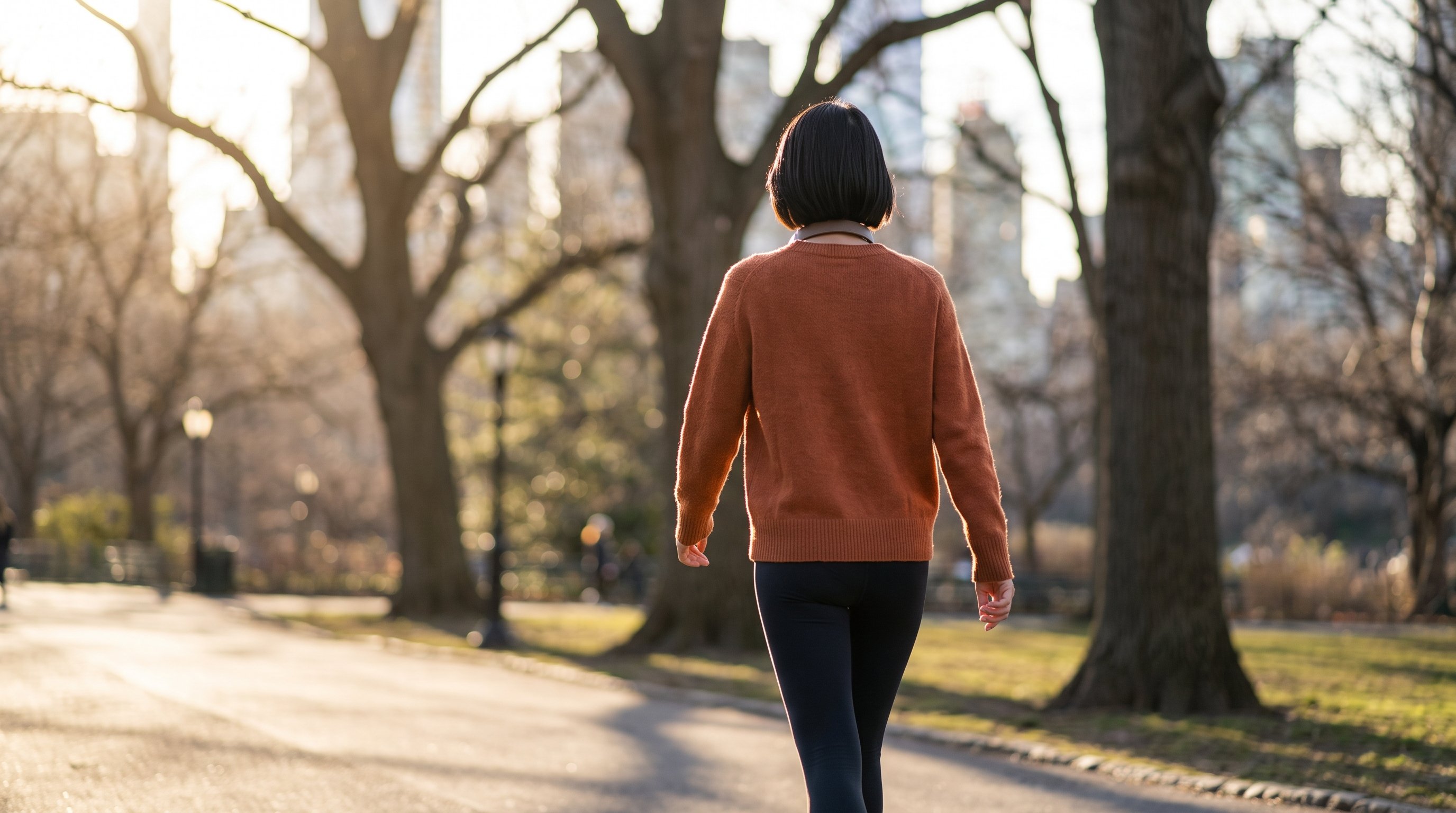 person doing a short walk through a quiet park