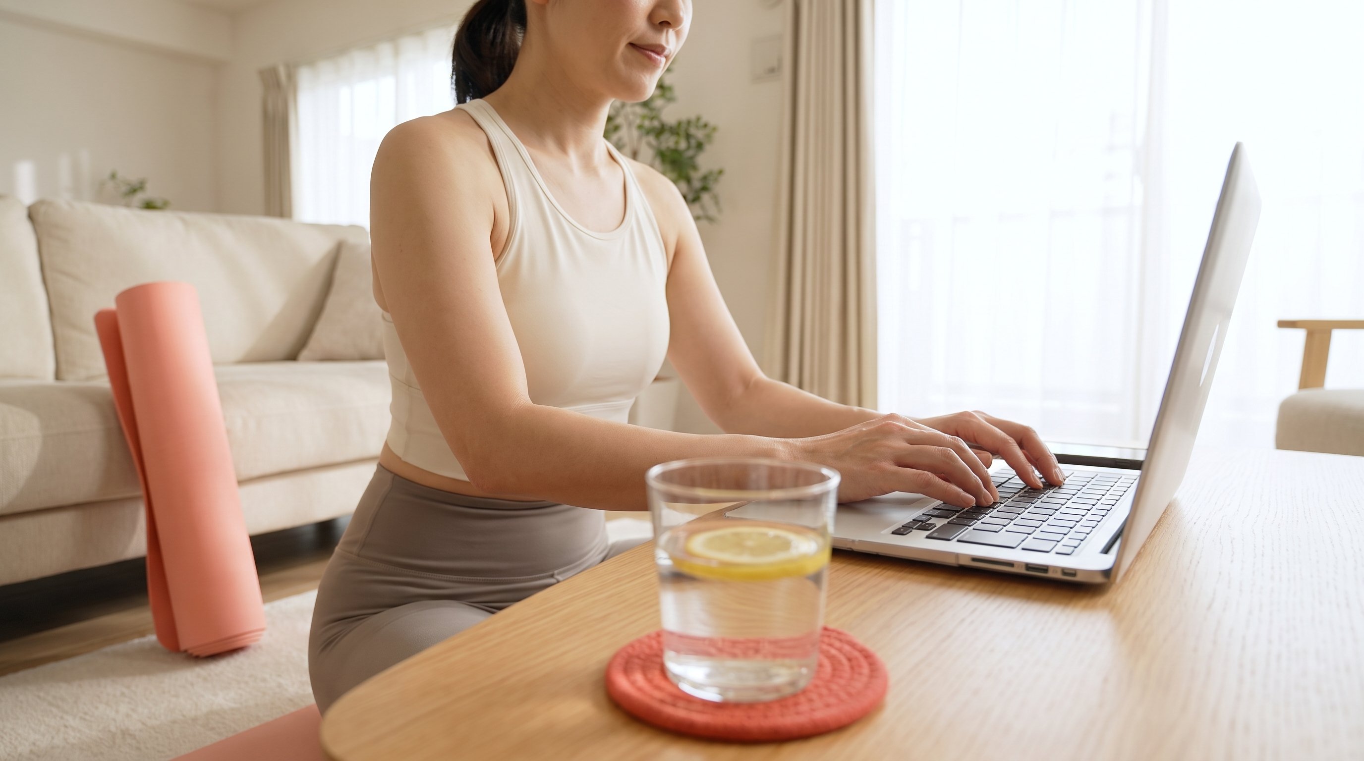 person writing a support email on a laptop at home