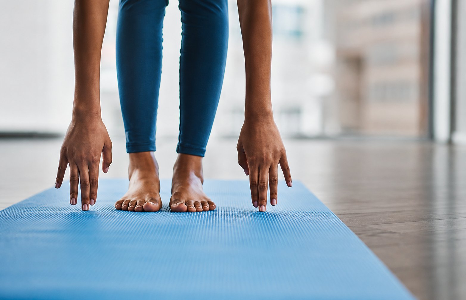 nord-pilates-close-up-forward-fold-hands-feet-blue-mat-flexibility-pilates nord-pilates-close-up-forward-fold-hands-feet-blue-mat-flexibility-pilates